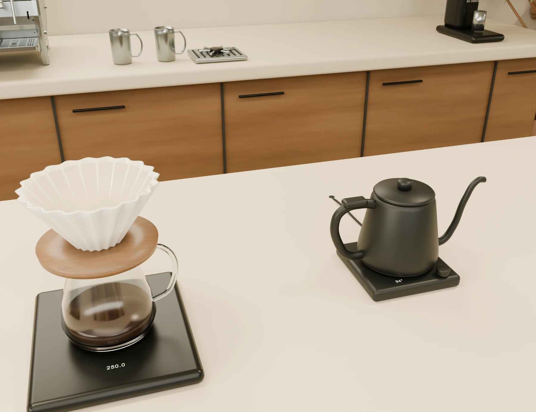 A matte black gooseneck kettle beside a paper-lined Origami dripper and glass server.